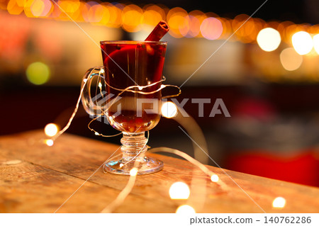 Tasty aromatic mulled wine on table at winter fair 140762286