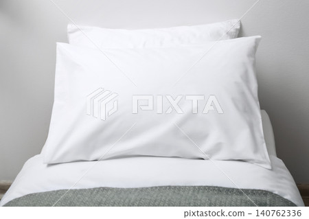 Bed with soft fluffy pillows at home Bed with soft fluffy pillows at home 140762336