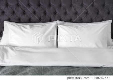 Bed with soft fluffy pillows at home Bed with soft fluffy pillows at home 140762338