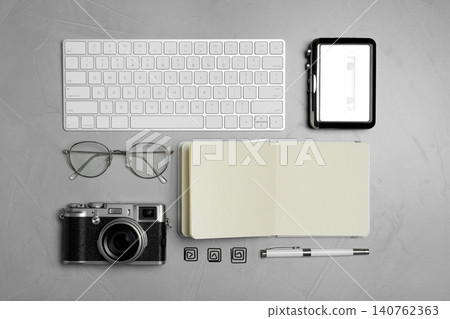 Flat lay composition with equipment for journalist on grey stone table Flat lay composition with equipment for journalist on grey stone table 140762363