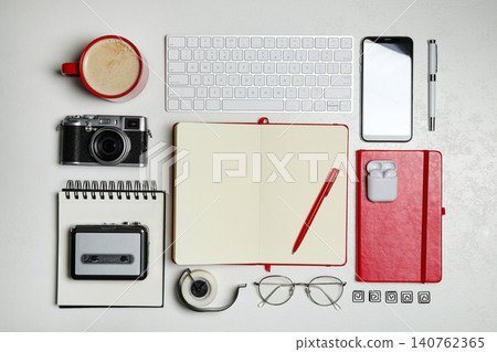 Flat lay composition with equipment for journalist on white table Flat lay composition with equipment for journalist on white table 140762365