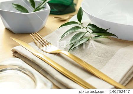 Elegant table setting with green leaves, closeup 140762447