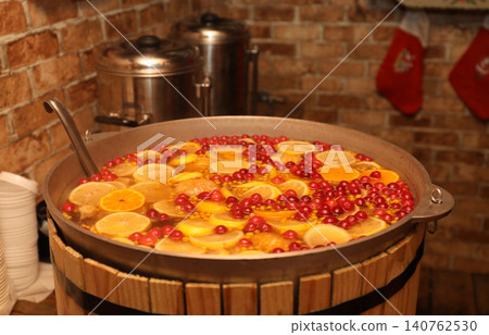 Large cauldron with tasty mulled wine at winter fair 140762530