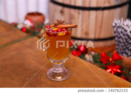 Tasty aromatic mulled wine on wooden table 140762535