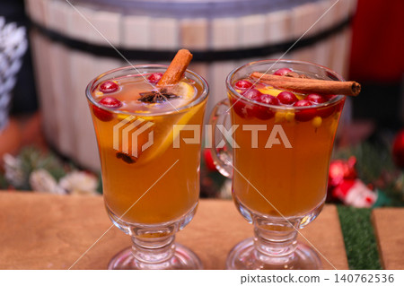 Tasty aromatic mulled wine on wooden table 140762536