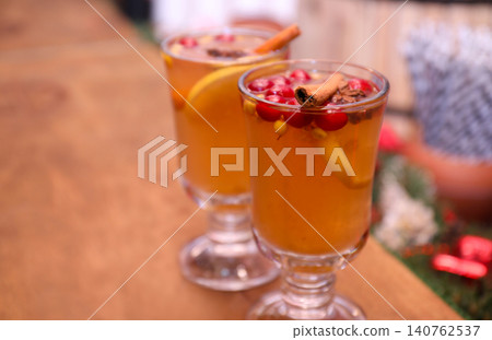 Tasty aromatic mulled wine on wooden table 140762537