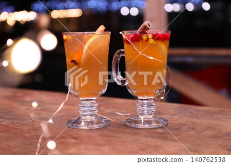 Tasty aromatic mulled wine on wooden table Tasty aromatic mulled wine on wooden table 140762538