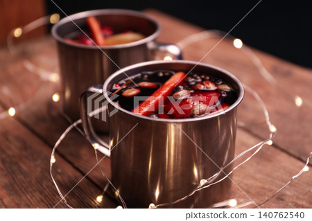 Tasty aromatic mulled wine on wooden table Tasty aromatic mulled wine on wooden table 140762540