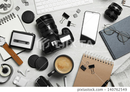 Flat lay composition with equipment for journalist on light table Flat lay composition with equipment for journalist on light table 140762549