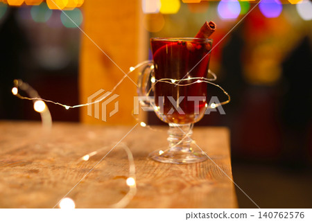 Tasty aromatic mulled wine on table at winter fair 140762576