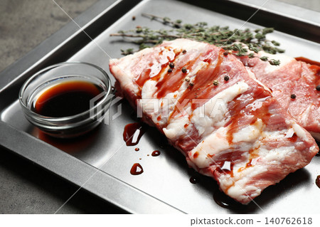 Fresh raw ribs on baking sheet, closeup Fresh raw ribs on baking sheet, closeup 140762618