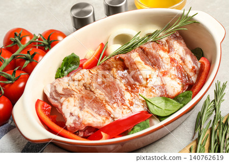 Raw spare ribs with garnish on light table, closeup Raw spare ribs with garnish on light table, closeup 140762619