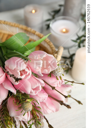 Beautiful bouquet with spring pink tulips on table, closeup 140762639