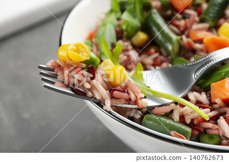 Tasty brown rice with vegetables, closeup view Tasty brown rice with vegetables, closeup view 140762673