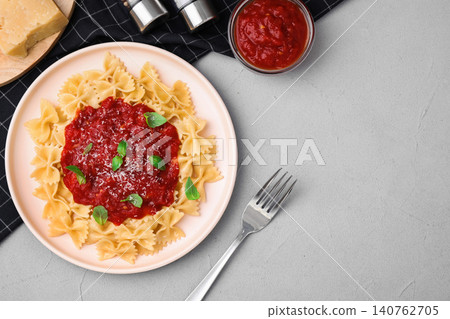 Flat lay composition with tasty pasta on light grey table Flat lay composition with tasty pasta on light grey table 140762705