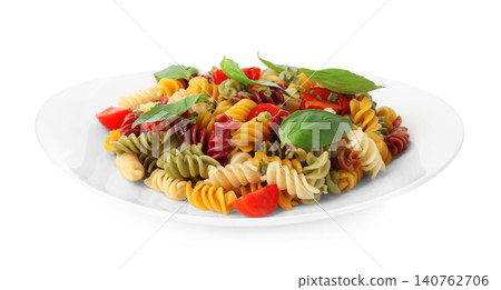 Colorful pasta with basil and cherry tomatoes isolated on white Colorful pasta with basil and cherry tomatoes isolated on white 140762706