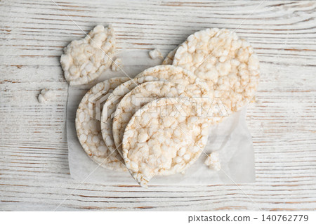 Puffed rice cakes on white wooden table, flat lay Puffed rice cakes on white wooden table, flat lay 140762779