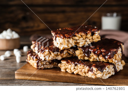 Delicious rice crispy treats on wooden table, closeup 140762801