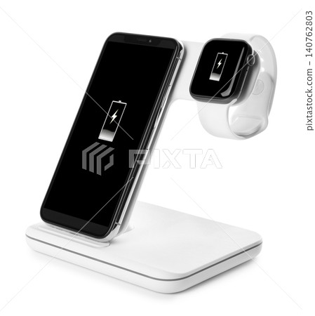 Mobile phone and smartwatch charging with wireless pad isolated on white 140762803