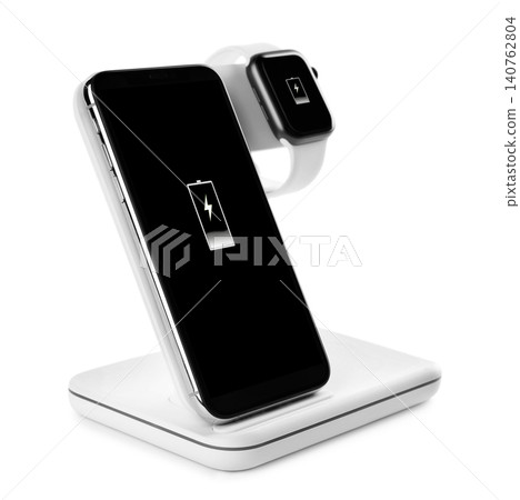 Mobile phone and smartwatch charging with wireless pad isolated on white 140762804