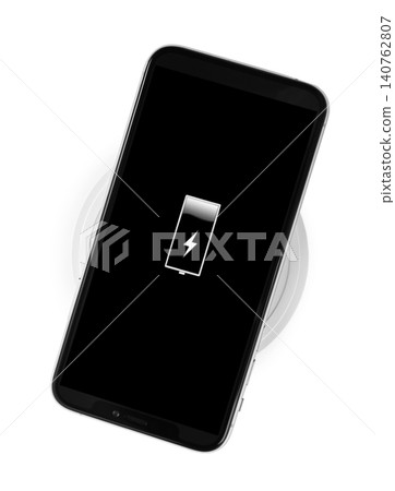 Mobile phone charging with wireless pad isolated on white, top view 140762807