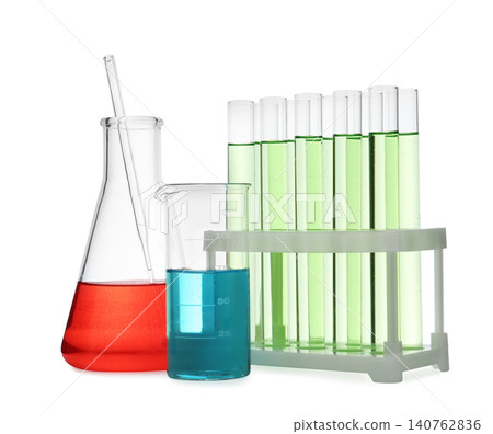 Different laboratory glassware with color liquid isolated on white Different laboratory glassware with color liquid isolated on white 140762836