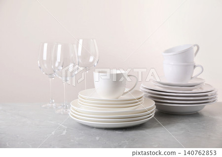 Set of clean tableware on light grey marble table Set of clean tableware on light grey marble table 140762853