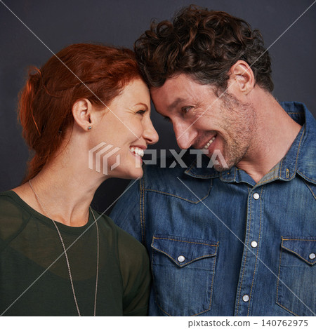 Love, smile and couple in studio together with happy relationship, trust and support. Romance, man and woman embrace on dark background with commitment, loyalty and affection Love, smile and couple in studio together with happy relationship, trust and support. Romance, man and woman embrace on dark background with commitment, loyalty and affection 140762975