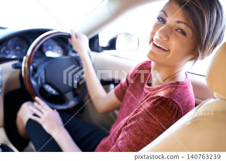 Portrait, driving and business woman with travel on morning commute, road trip or journey to work. Smile, transport and happy driver at wheel of car with confidence, test drive and auto insurance. 140763239