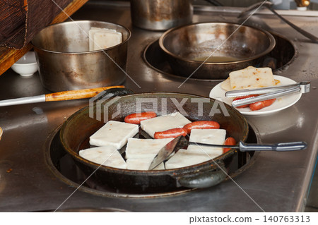Taiwanese breakfast cooking with tofu and sausages 140763313
