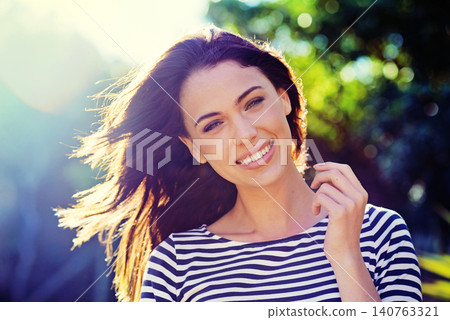 Woman, portrait and smile with nature, sunset and park for happiness and wellness. Person, joy and sunshine with closeup, glow and beauty for summer relax and adventure outside in garden with trees Woman, portrait and smile with nature, sunset and park for happiness and wellness. Person, joy and sunshine with closeup, glow and beauty for summer relax and adventure outside in garden with trees 140763321