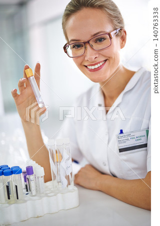 Happy, test tube or woman scientist in portrait for research, medical liquid sample or virus experiment. Solution, smile or science expert with vaccine cure for development or results review in lab Happy, test tube or woman scientist in portrait for research, medical liquid sample or virus experiment. Solution, smile or science expert with vaccine cure for development or results review in lab 140763338