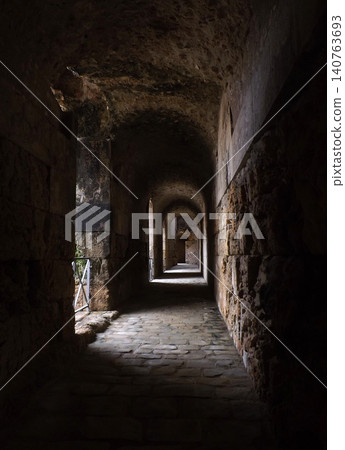 Dark gallery around the arena in a amphitheater Dark gallery around the arena in a amphitheater 140763693
