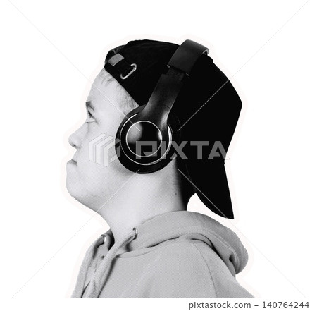 Young male wearing black headphones and a black cap, profile view, with a neutral expression, dressed in a gray hoodie against a white background Young male wearing black headphones and a black cap, profile view, with a neutral expression, dressed in a gray hoodie against a white background 140764244