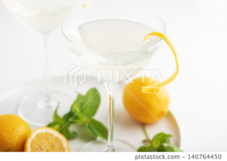 Citrus cocktail with lemon twist and fresh mint Citrus cocktail with lemon twist and fresh mint 140764450