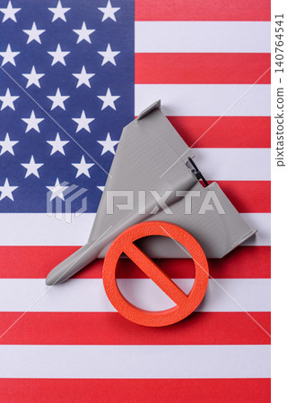 A Shahed drone featuring a prohibition symbol on the US flag, serving as a conceptual background A Shahed drone featuring a prohibition symbol on the US flag, serving as a conceptual background 140764541
