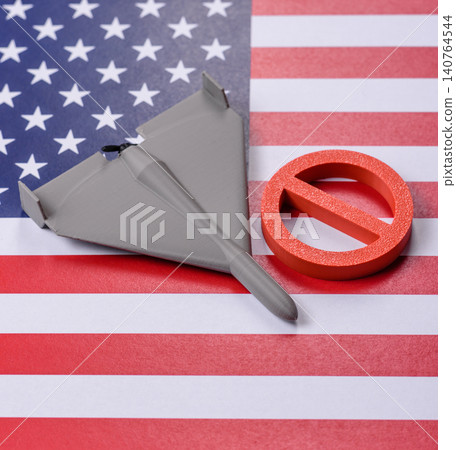 A Shahed drone featuring a prohibition symbol on the US flag, serving as a conceptual background A Shahed drone featuring a prohibition symbol on the US flag, serving as a conceptual background 140764544