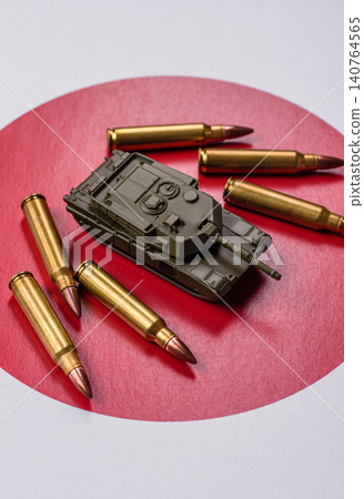 A tank on the Japanese flag as a conceptual backdrop representing defense A tank on the Japanese flag as a conceptual backdrop representing defense 140764565