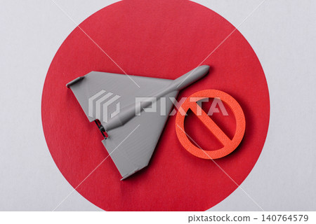 A Shahed drone featuring a prohibition symbol on the Japanese flag as a conceptual background A Shahed drone featuring a prohibition symbol on the Japanese flag as a conceptual background 140764579