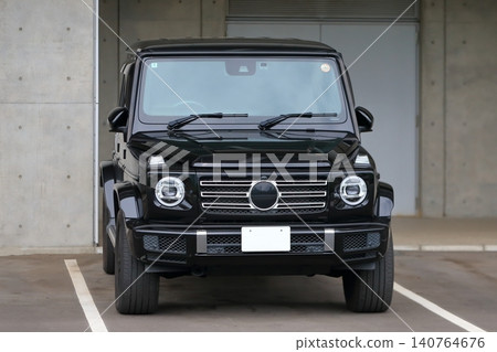 A black German-made SUV parked in the parking lot. A black German-made SUV parked in the parking lot. 140764676