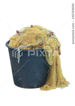 Fishing net with floats overflowing black bucket Fishing net with floats overflowing black bucket 140764699