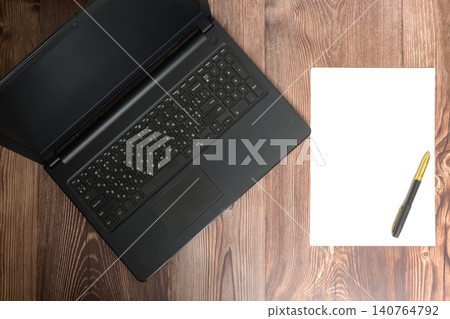 laptop and paper with pen top view laptop and paper with pen top view 140764792