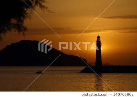 Seascape at sunshine. Lighthouse and sailings on the coast. Seaside town of Turgutreis and spectacular sunshine 140765962