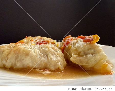 Cabbage rolls stewed in tomato sauce, cabbage leaves stuffed with meat and rice. Delicious and healthy home cooking. Cabbage rolls stewed in tomato sauce, cabbage leaves stuffed with meat and rice. Delicious and healthy home cooking. 140766078