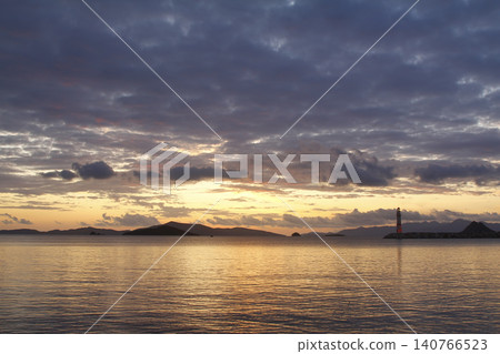 Seascape at sunshine. Lighthouse and sailings on the coast. Seaside town of Turgutreis and spectacular sunshine Seascape at sunshine. Lighthouse and sailings on the coast. Seaside town of Turgutreis and spectacular sunshine 140766523
