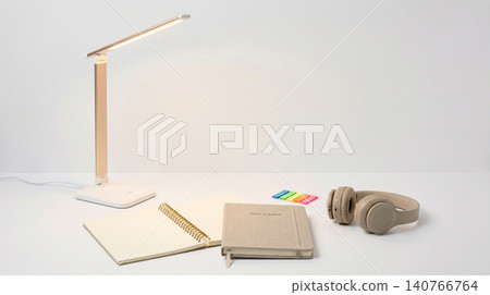 Minimalist workspace desk with led lamp and notebook workspace notebook headphones minimalist lighting organization technology education productivity background interior planning business Minimalist workspace desk with led lamp and notebook workspace notebook headphones minimalist lighting organization technology education productivity background interior planning business 140766764