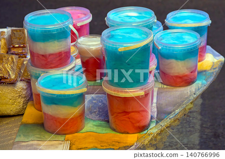 Candy floss material in buckets Candy floss material in buckets 140766996