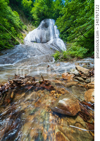 Miroku Falls, surrounded by fresh greenery, in Tago Town, Aomori Prefecture Miroku Falls, surrounded by fresh greenery, in Tago Town, Aomori Prefecture 140767122