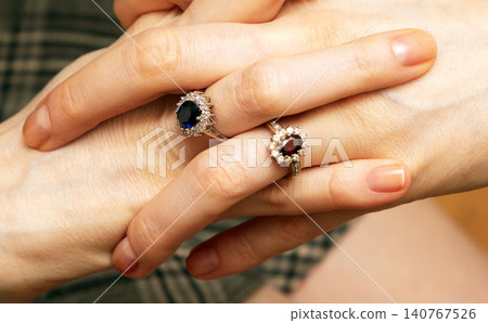 Diamond rings on female hands Diamond rings on female hands 140767526