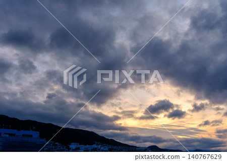 The dawn of the city: From a high floor of an apartment building in Higashinada Ward, Kobe City, at dawn. The dawn of the city: From a high floor of an apartment building in Higashinada Ward, Kobe City, at dawn. 140767629